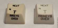 Слева - клавиша от старой клавиатуры «Байта». Справа - клавиша с лазерной гравировкой и с ошибкой «INKKEY$»